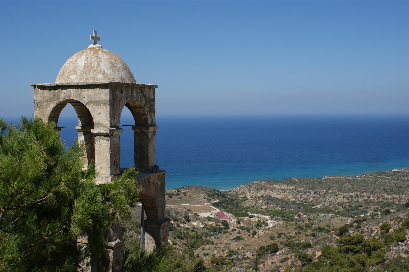 An old bell tower in Kos overlooking the coast