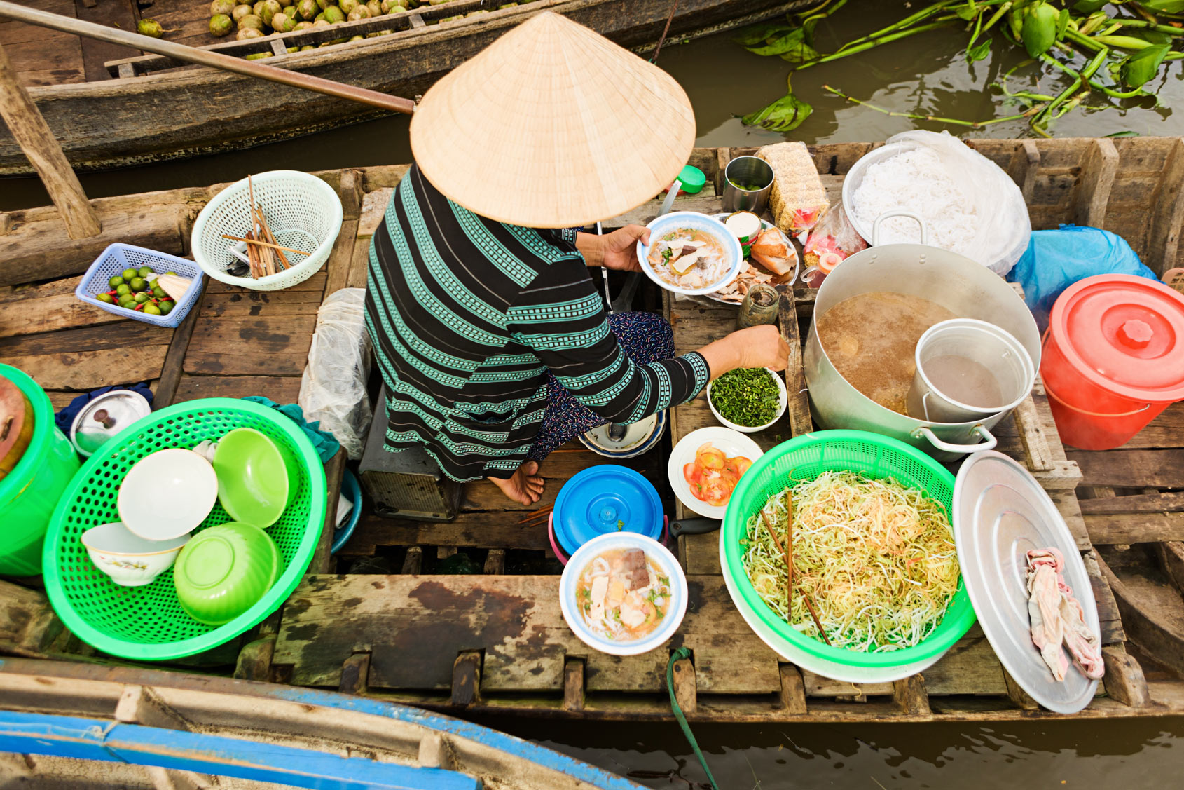 Vietnamese Pho seller on floating market - Mekong river delta, Vietnam.