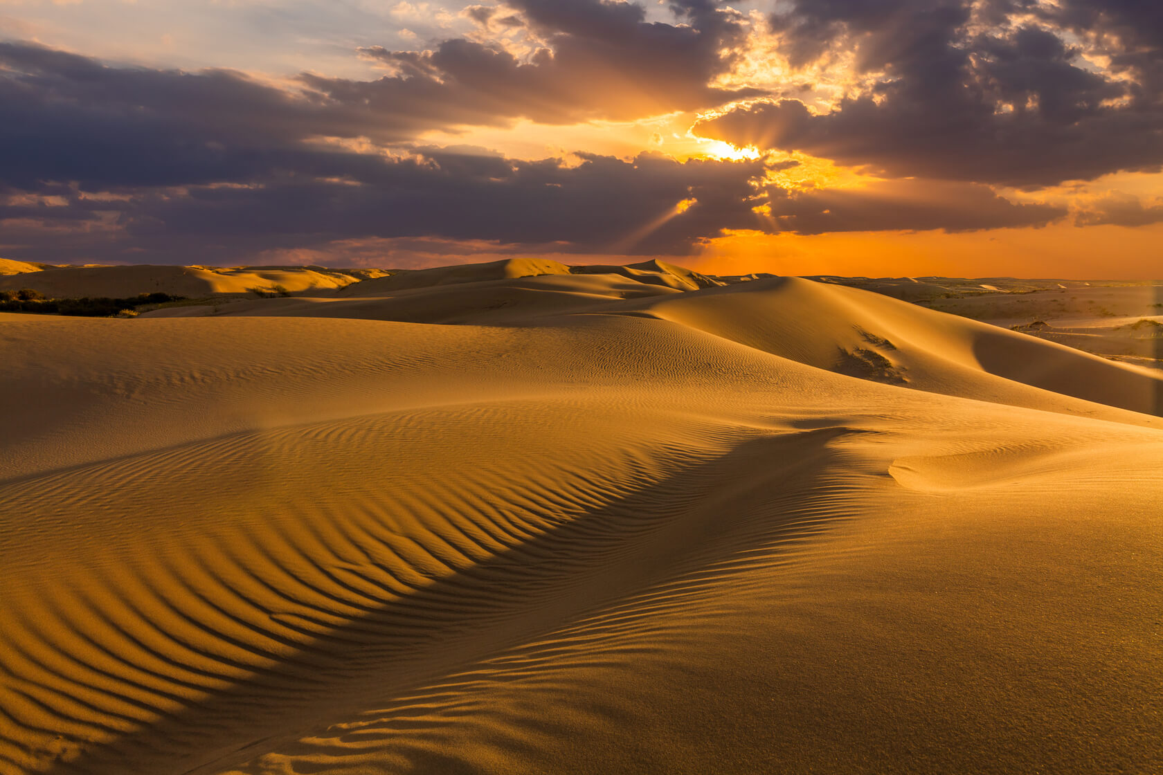 Sand dunes in the desert at sunset Doha