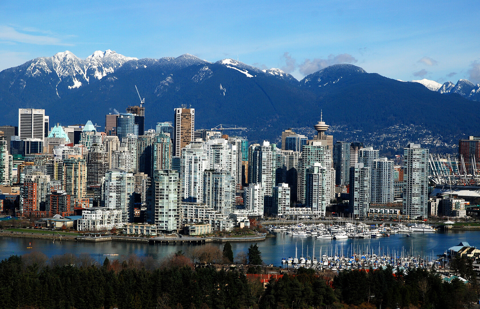 vancouver in the winter time, Vancouver with False Creek in foreground and Grouse Mountain and the North Shore Mountains in background