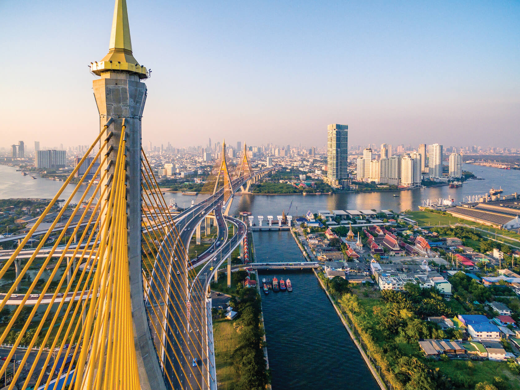 A an aerial view of Bangkok overlooking a two leveled bridged