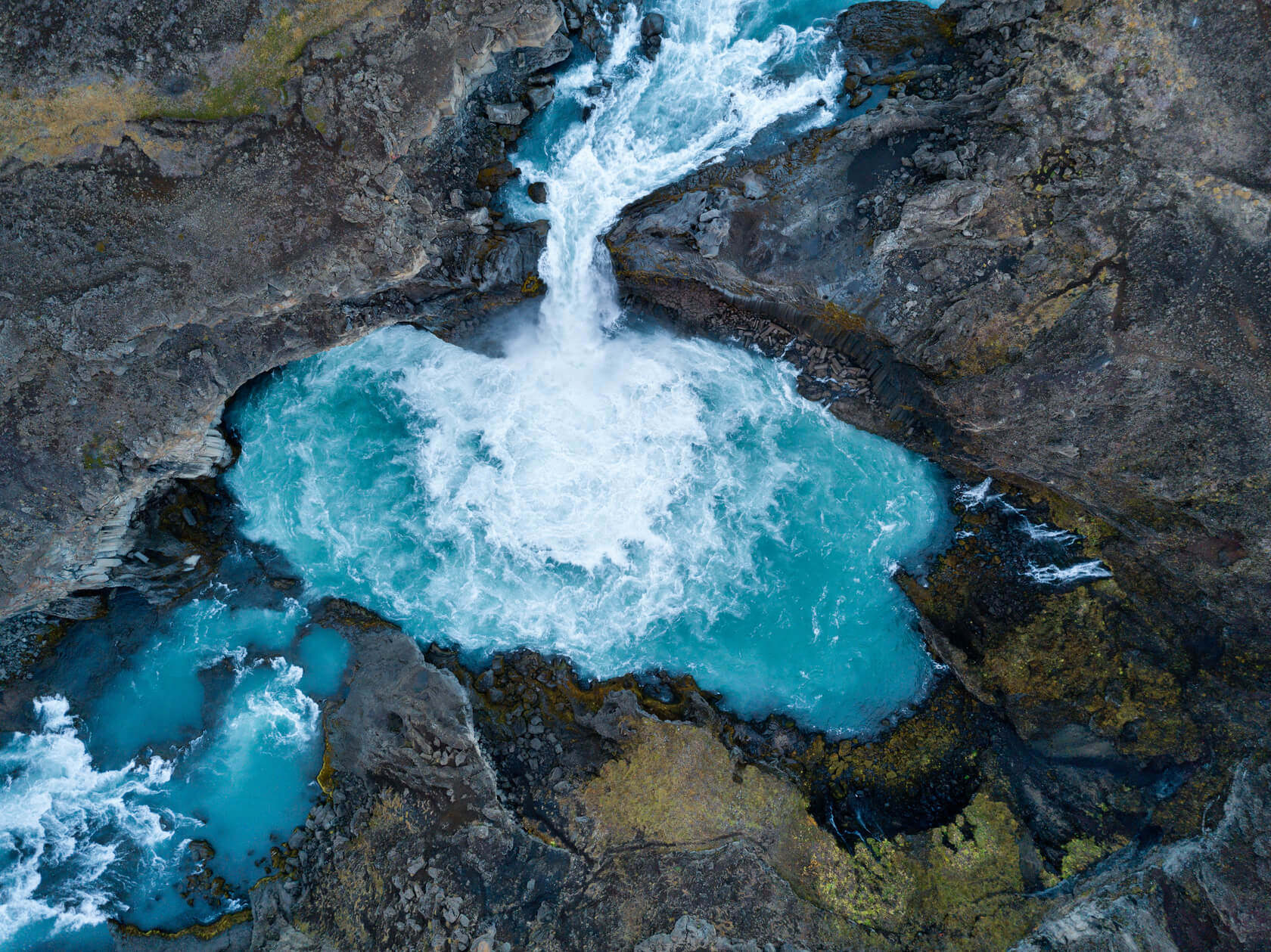 View of Aldeyjarfoss waterfall among the rocks in Iceland