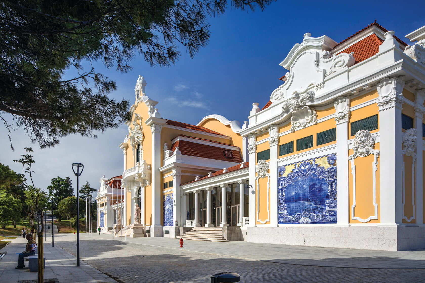 Portuguese architecture with yellow building and white pillars