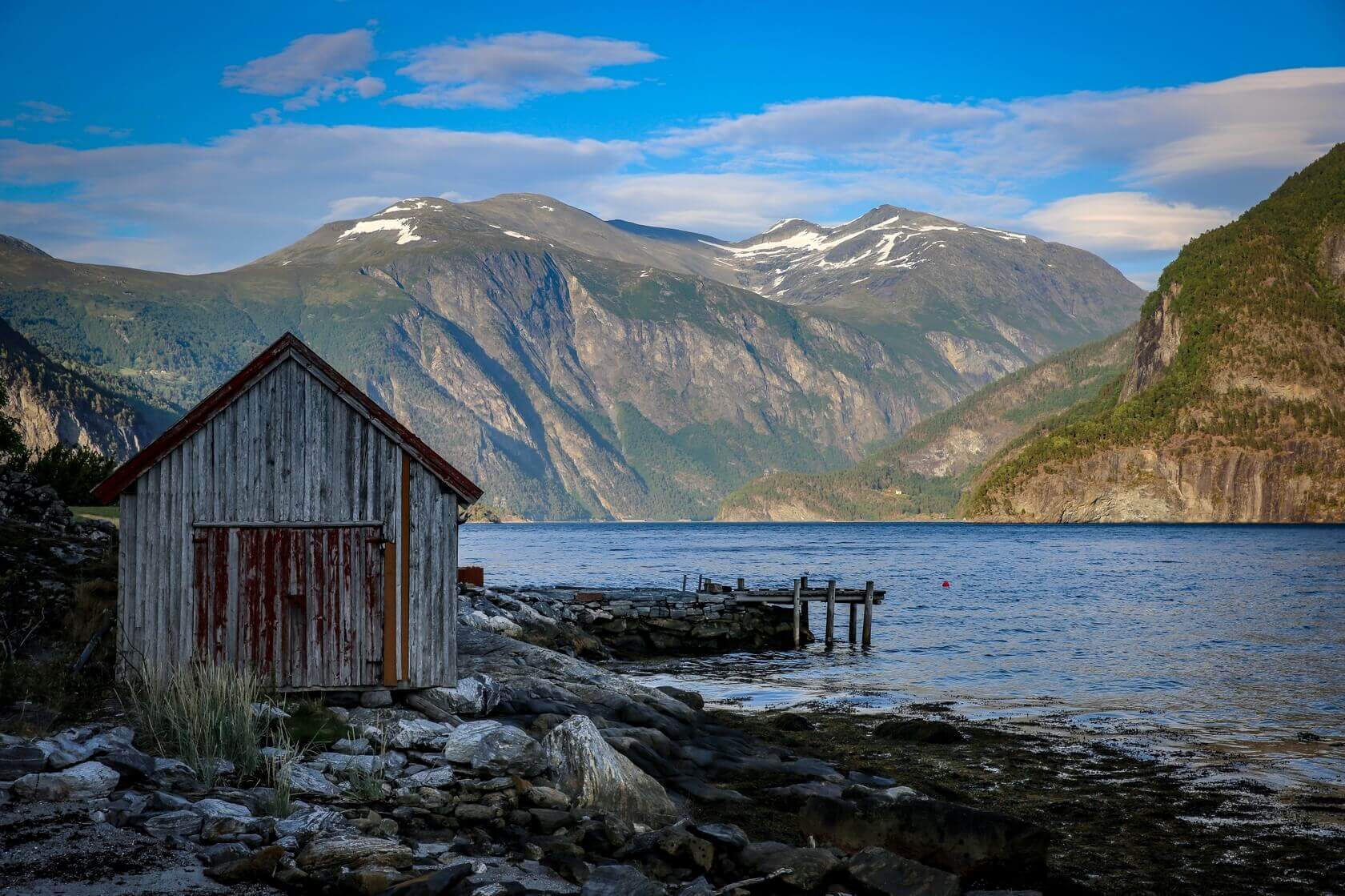 A landscape image of the mountains at Valldal overlooking a bay