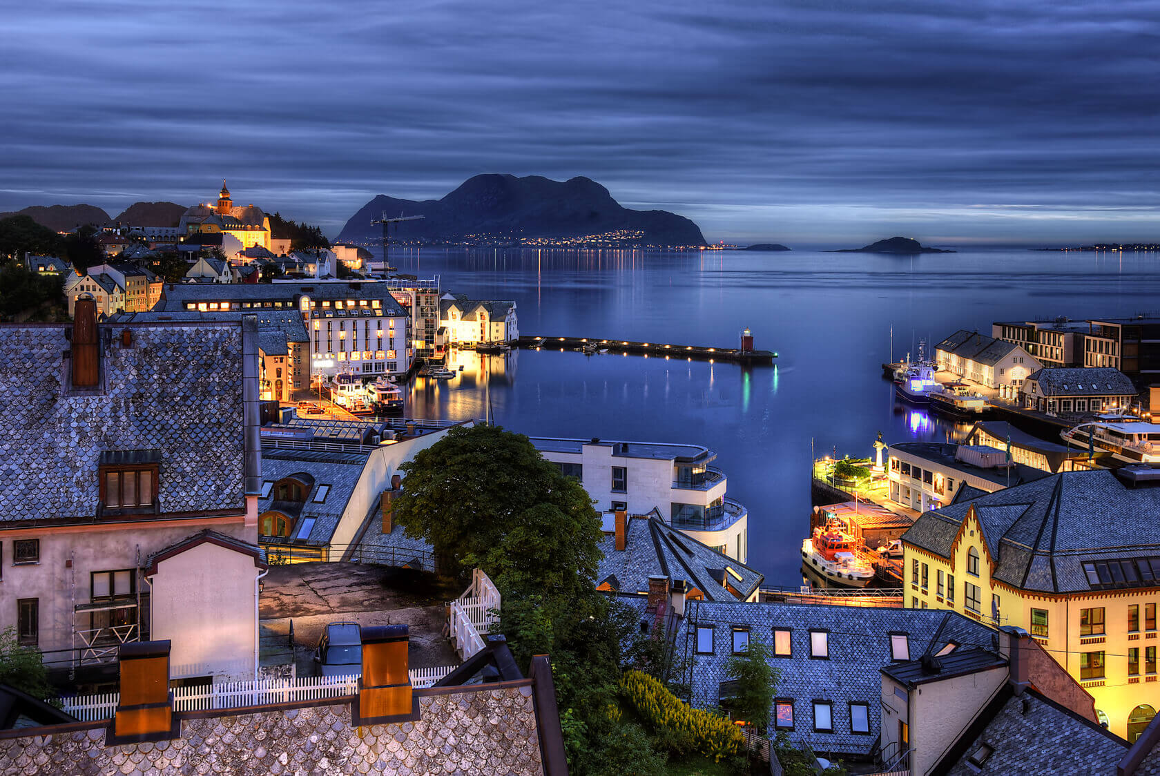 A overhead photo of Alesund, Norway at dusk. 